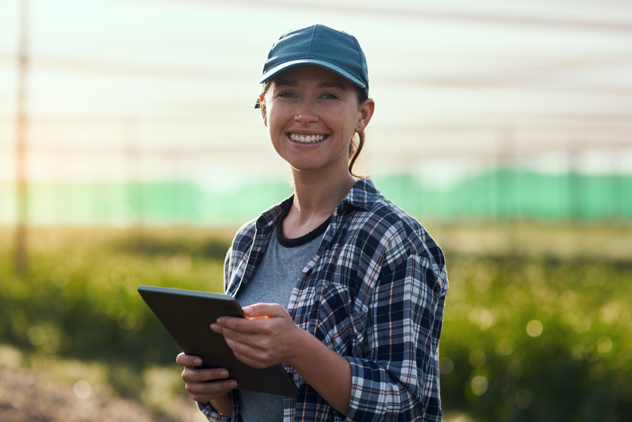 Farmer using the MyCrops SCOUT mobile app on a tablet